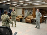 U.S. Air Force Col. Steven Anderson, 688th Cyberspace Wing commander, Chief Master Sgt. Israel Jaeger, 688th Cyberspace Wing Command Chief, Capt. Nathan Spradley, 502nd Air Base Wing, Master Sgt. Stephanie Russ, 323rd Training Squadron, and Staff Sgt. Ryan Owen, 67th Operations Support Squadron, volunteer for charge of quarters duty in support of Basic Military Training Airmen overnight Tuesday, April 7, 2020, Joint Base San Antonio – Lackland, Texas. CQ duties include intake, tracking and reporting, wellness checks, meal and personal item delivery, and arranging transport upon release. (U.S. Air Force photo by Chief Master Sgt. Israel Jaeger)