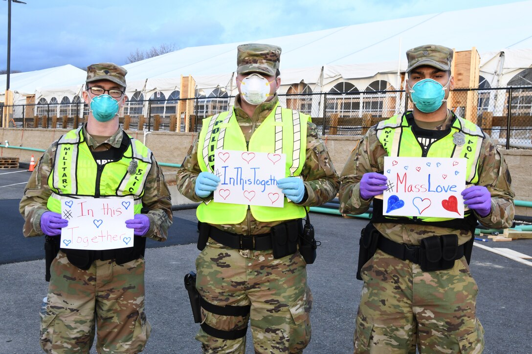 Airmen and Soldiers of the Massachusetts National Guard take a photo they respond together to help their communities during the COVID-19 response. Security Forces Airmen from the 104th Fighter Wing, Barnes Air National Guard Base, Mass., and Soldiers with the 747th Military Police Company, Massachusetts Army National Guard, are providing 24-hour security for testing sites and shelters for the homeless who may be positive COVID-19. The Airmen and Soldiers are working with interagency partners Springfield Police Department to ensure security and safety for the supplies, patients, and staff. Massachusetts National Guard units were activated at the request of Governor Charlie Baker and are helping at the testing facilities as a joint-task force. (Left to Right: Spc. Haley MacDonald and Spc. Alan Navarro) (U.S. Air National Guard Photo by Senior Master Sgt. Julie Avey)