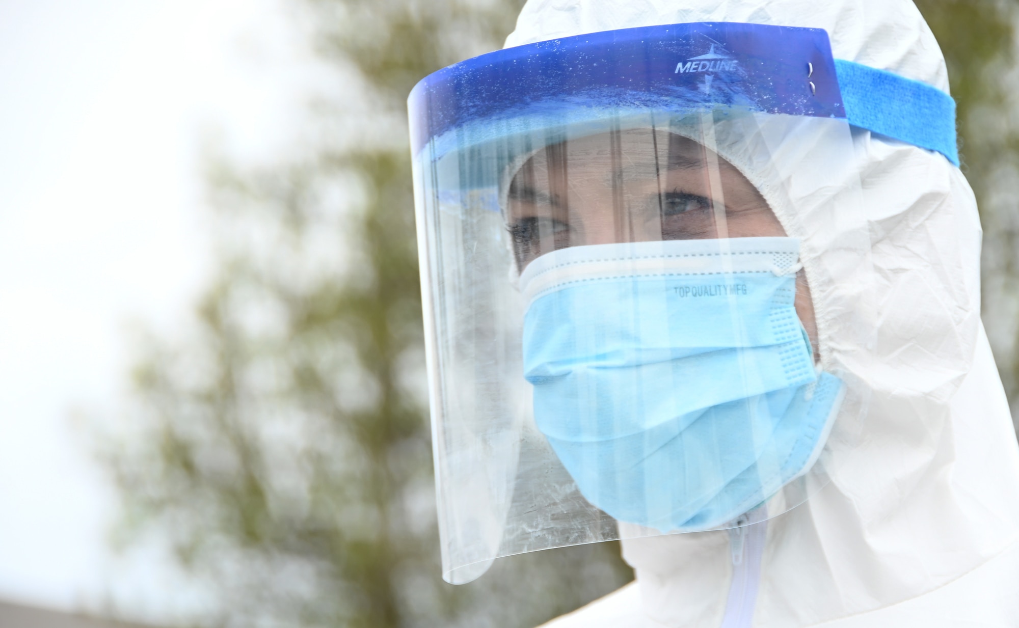 U.S. Air Force Tech. Sgt. Leigh Crane, an aerospace medical technician with the 118th Medical Group, Tennessee Air National Guard, waits for a patient to arrive at a drive-up COVID-19 testing site March 30, 2020 in Livingston, Tennessee. (U.S. Air National Guard photo by Master Sgt. Jeremy Cornelius).