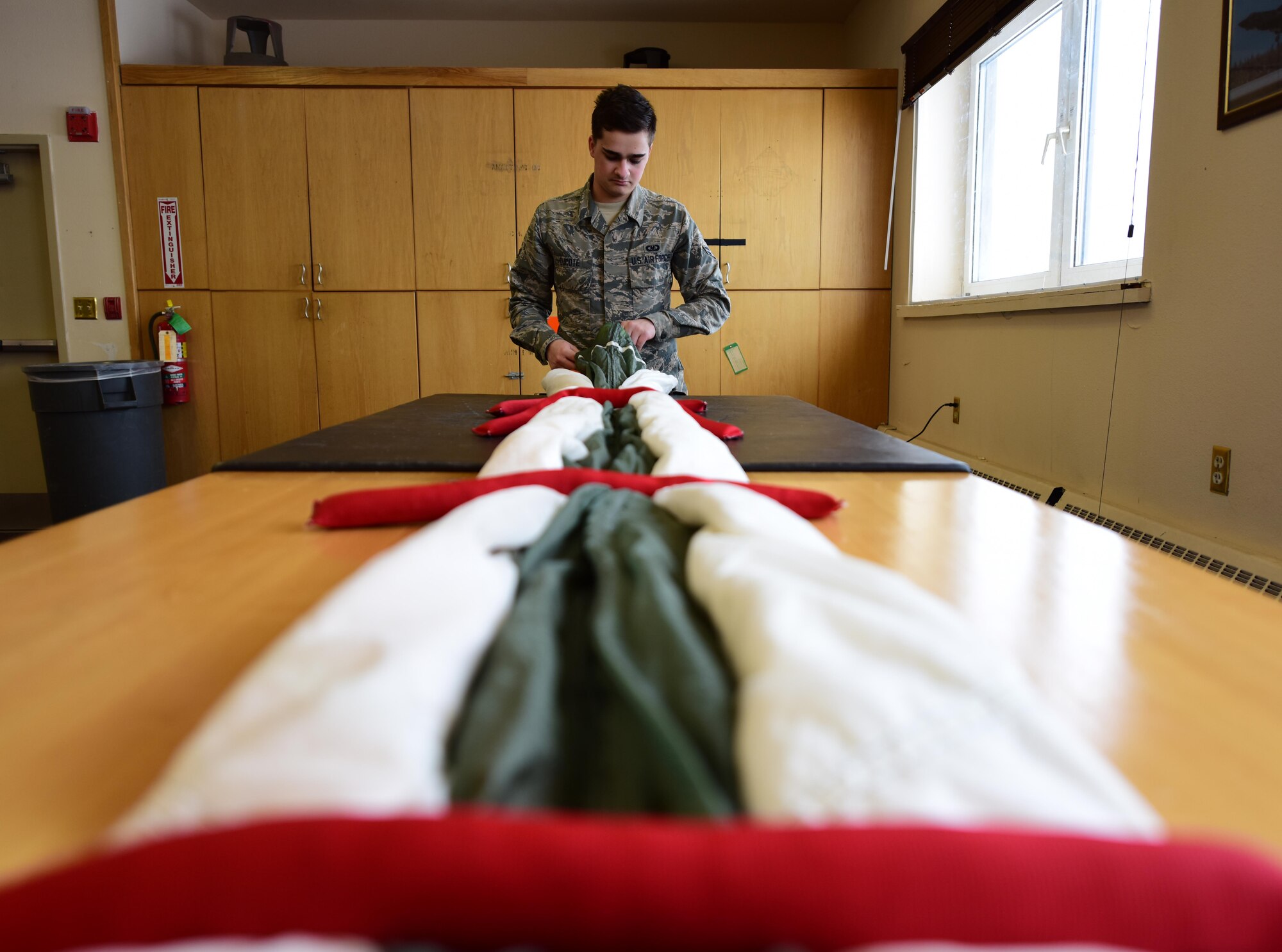 U.S. Air Force Airman 1st Class Jordan Decote, a 354th Aircrew Flight Equipment journeyman, stores the canopy of an Advanced Concept Ejection Seat II parachute April 6, 2020 at Eielson Air Force Base, Alaska.