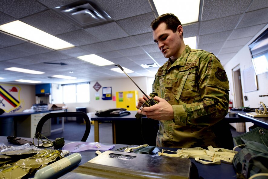U.S. Air Force Staff Sgt. Ross Duggar, a 354th Aircrew Flight Equipment craftsman, inspects the components of a seat kit on April 6, 2020, at Eielson Air Force Base, Alaska.