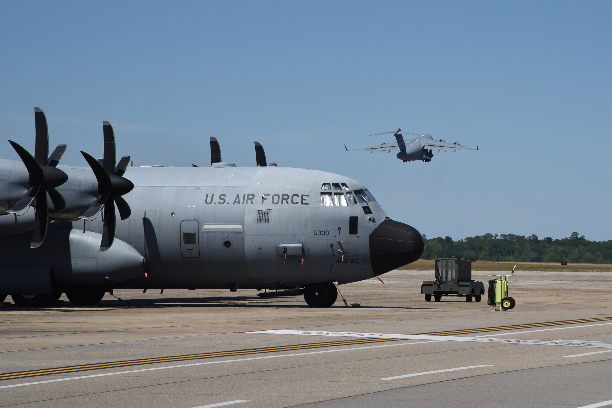 A C-17 Globemaster III flown by the 89th Airlift Squadron, based out of Wright-Patterson Air Force Base, Ohio, departs Keesler AFB, Miss., April 15, 2020. Approximately 10 Airmen with the 403rd Wing's 36th Aeromedical Evacuation Squadron mobilized to support COVID-19 relief efforts. These reservists will provide life-saving in-flight patient care. (U.S. Air Force photo by Lt. Col. Marnee A.C. Losurdo)