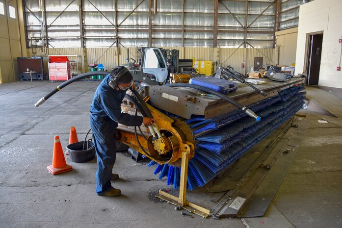 U. S. Air Force Staff Sgt. Michael Natan, 8th Logistics Readiness Squadron vehicle maintenance seasonal equipment maintenance assistant NCO in charge,  repairs a street sweeper at Kunsan Air Base, Republic of Korea, April 14, 2020. Vehicles such as the street sweeper perform mission critical services such as keeping flight lines free of debris and ensuring the safety of the flying mission. (U.S. Air Force photo by Tech. Sgt. Joshua Arends)