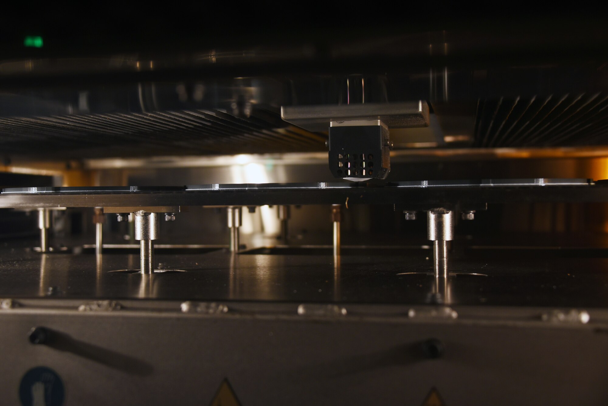 A 3D printer at the 982nd Maintenance Squadron prints off face shield brackets for the fight against COVID-19 at Sheppard Air Force Base, Texas, April 7, 2020. The 3D printers up to this point have been used in creating a variety of components used in the training environment. (U.S. Air Force photo by Staff Sgt. Robert L. McIlrath)