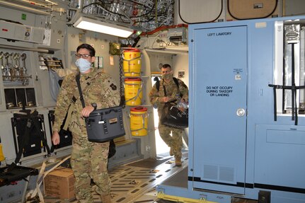 Personnel with the 433rd Aeromedical Evacuation Squadron board a C-17 Globemaster III April 15, 2020 at Joint Base San Antonio-Lackland, Texas.
