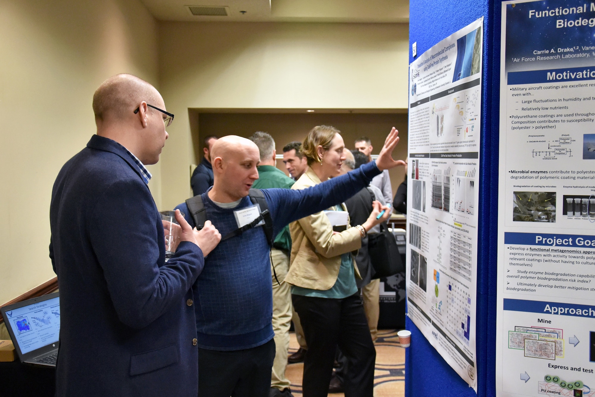 Dr. Drew Wagner (UES/Materials and Manufacturing Directorate) and Dr.Matthew Dickerson (Materials and Manufacturing Directorate) discuss the recombinant production of sub-micron gas vesicles and their potential in military applications. (U.S. Air  Force photo/Spencer Deer)