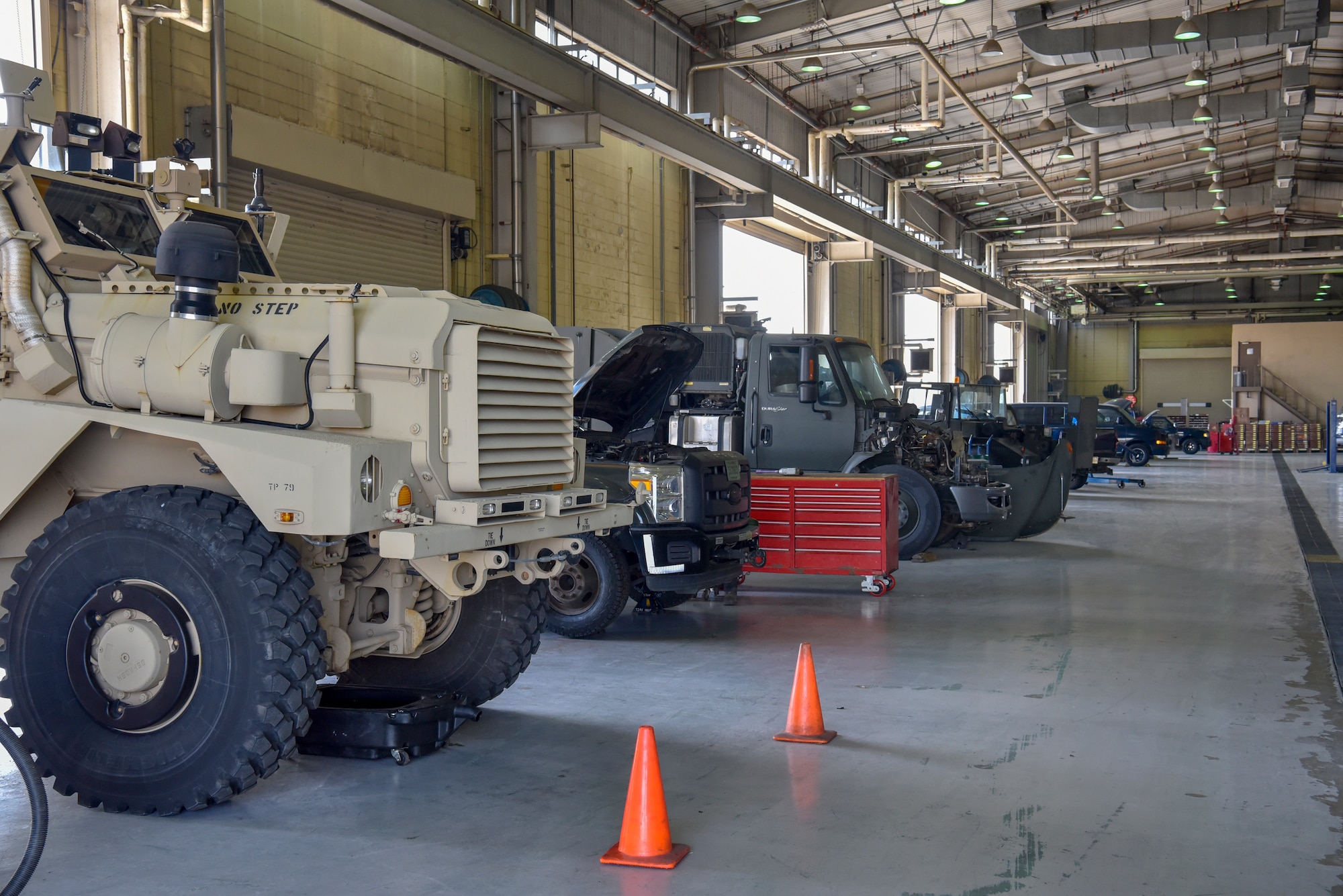 Vehicles assigned to the 8th Logistics Readiness Squadron vehicle management flight are lined up in a maintenance bay for repair at Kunsan Air Base, Republic of Korea, April 14, 2020. The ever-expanding fleet of  vehicles includes 62 construction and sortie-generating vehicles, such as mission critical refueling trucks. (U.S. Air Force photo by Tech. Sgt. Joshua Arends)