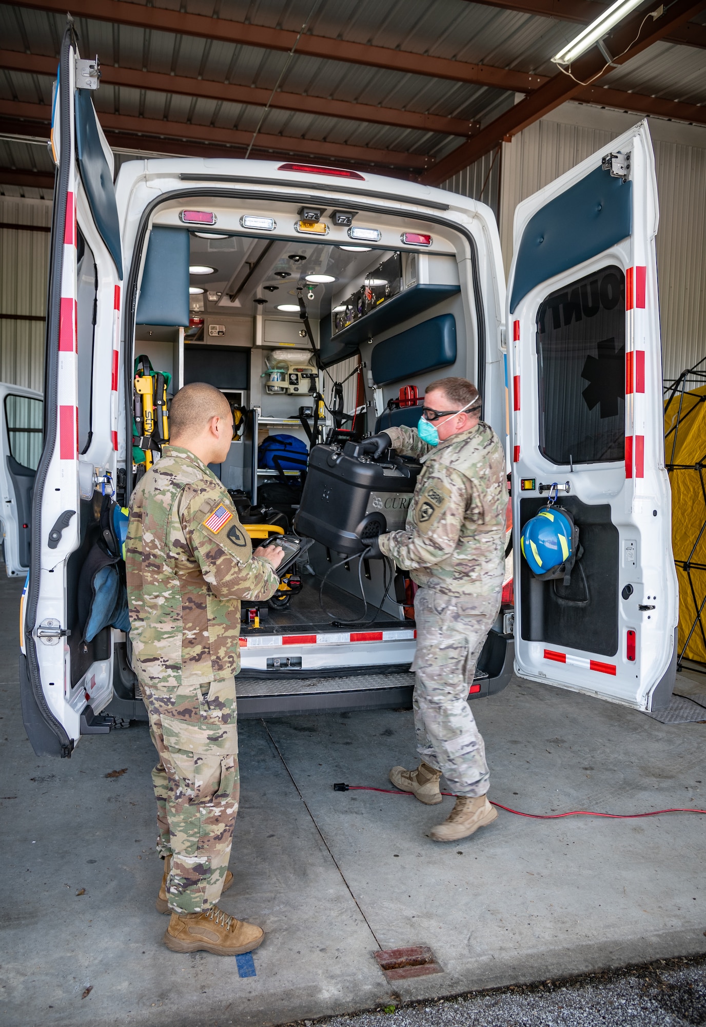 Members of the West Virginia National Guard perform COVID-19 decontamination of first responder apparatuses with a Vaporized Hydrogen Peroxide system at Yeager Airport, Charleston, West Virginia, April 14, 2020. More than 250 apparatus belonging to Emergency Medical Services (EMS), police, and fire department medical units throughout the Kanawha County, West Virginia area are scheduled to be sanitized with this method in the next few days to ensure both employee and patient safety in an innovative and scalable effort to combat the ongoing global pandemic. (U.S. Army National Guard photo by Edwin L. Wriston)