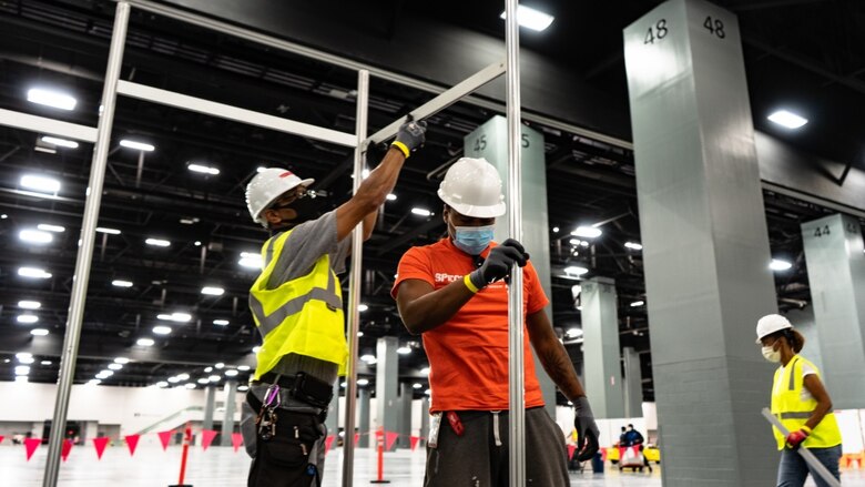 The Miami Beach Convention Center is now a 24 hour construction site crews work at a steady pace to install ICU and Acute Care pods. USACE staff awarded a construction contract Monday April 6, 2020 for $22.5 Million to Robins & Morton of Miami, Fla. to convert the Miami Beach Convention Center into a 450-bed alternate care facility.