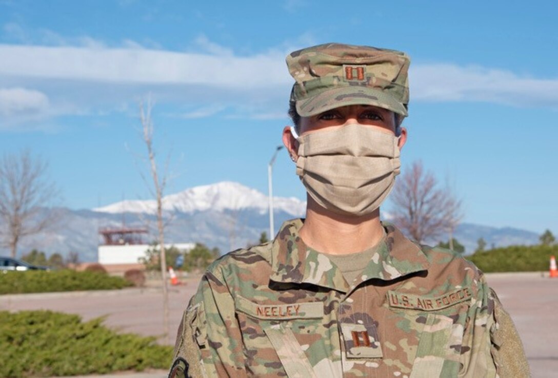 PETERSON AIR FORCE BASE, Colo. –Capt. Lorna Neeley, 21st Medical Group patient administration team chief, wears a face mask while assisting with the new drive-thru pharmacy located at the base exchange parking lot April 15, 2020. Customers can drive up to a series of stations and have their prescription delivered to their vehicle. This new procedure is being used to help prevent the spread of COVID-19. (Air Force photo by Staff Sgt. Alexandra M. Longfellow)
