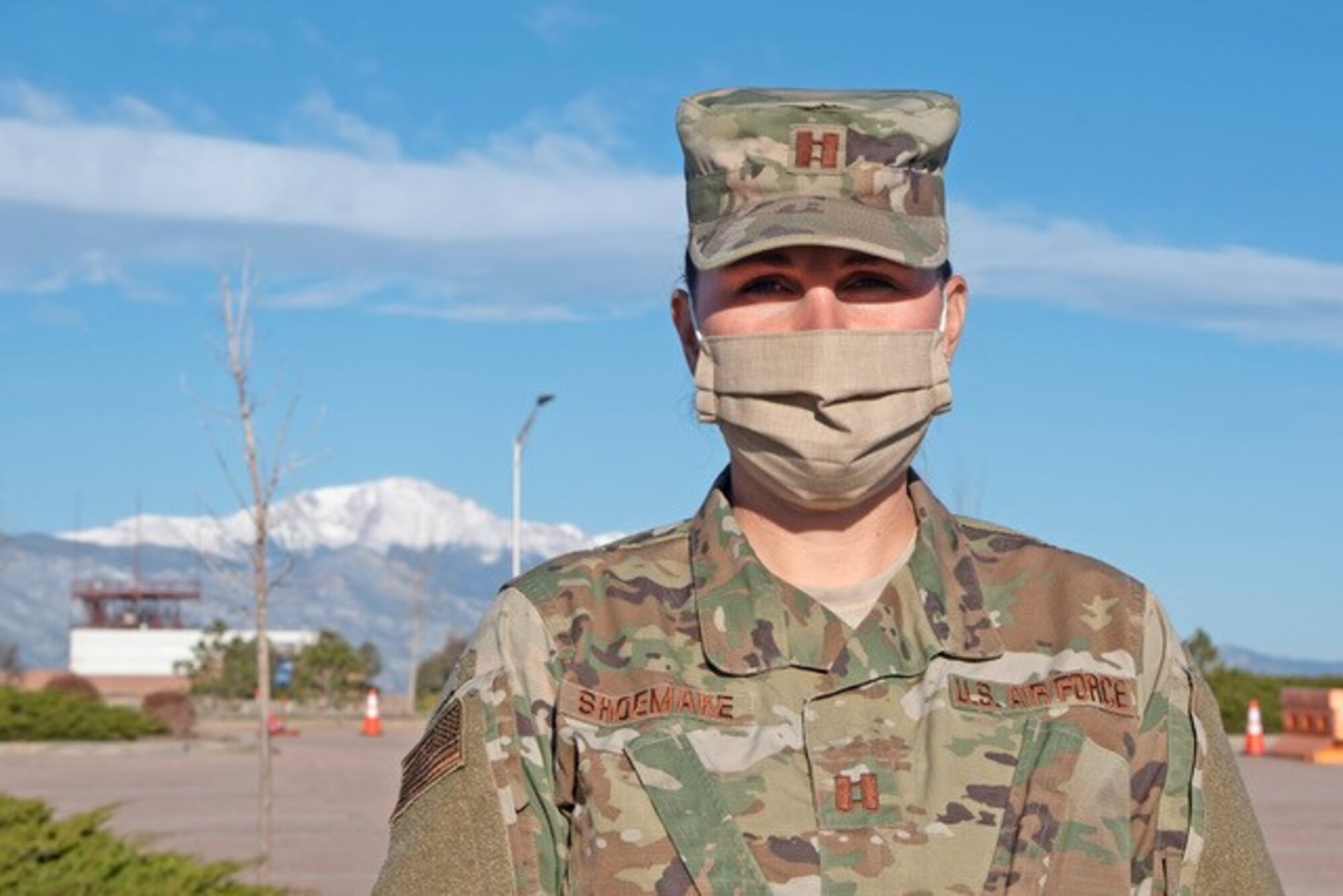 PETERSON AIR FORCE BASE, Colo. – Capt. Jennifer Shoemake, 21st Medical Group clinical team chief, wears a face mask while assisting with the new drive-thru pharmacy located at the base exchange parking lot April 15, 2020 at Peterson Air Force Base, Colorado. Individuals requiring prescriptions can now drive up, stay in their vehicle and their prescription will be delivered to them. This new procedure is being used to help prevent the spread of the COVID-19 virus. (Air Force photo by Staff Sgt. Alexandra M. Longfellow)