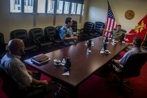 U.S. Marine Corps Col. Raul Lianez, commanding officer, Marine Corps Base Hawaii, and Douglas Wadsworth, chief of staff, MCBH speak to Sen. Jarrett Keohokolole (D-HI) and Sen. Gil Riviere (D-HI), MCBH, Apr. 15, 2020. Keohokolole and Riviere visited the base to discuss the COVID-19 response and toured the installation to observe how prepared and resilient the installation and MCBH community members are. MCBH is currently in Health Protection Condition Charlie, which is where the military and medical leaders are taking necessary precautions to prevent or respond to a potential outbreak. (U.S. Marine Corps photo by Cpl. Matthew Kirk)