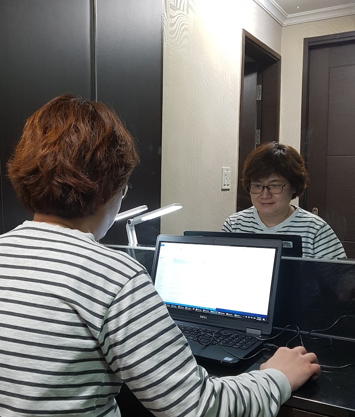 Hur, Myo Boon, U.S. Army Corps of Engineers, Far East District
architectural section chief, conducts work at her home during the district
telework schedule in response to preventing the spread of COVID 19, Apr. 15.