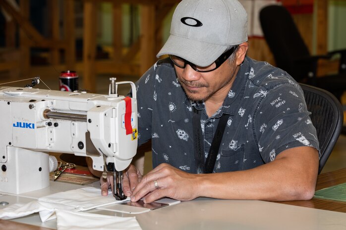 Norfolk Naval Shipyard’s (NNSY) Sail Loft personnel sewed facemasks to be delivered to the workforce.  As a temporary solution while NNSY’s Supply Department worked to order the necessary amount of COVID-19 specific Personal Protective Equipment (PPE), the Sail Loft produced more than 4,500 facemasks for project team members as well as support staff.