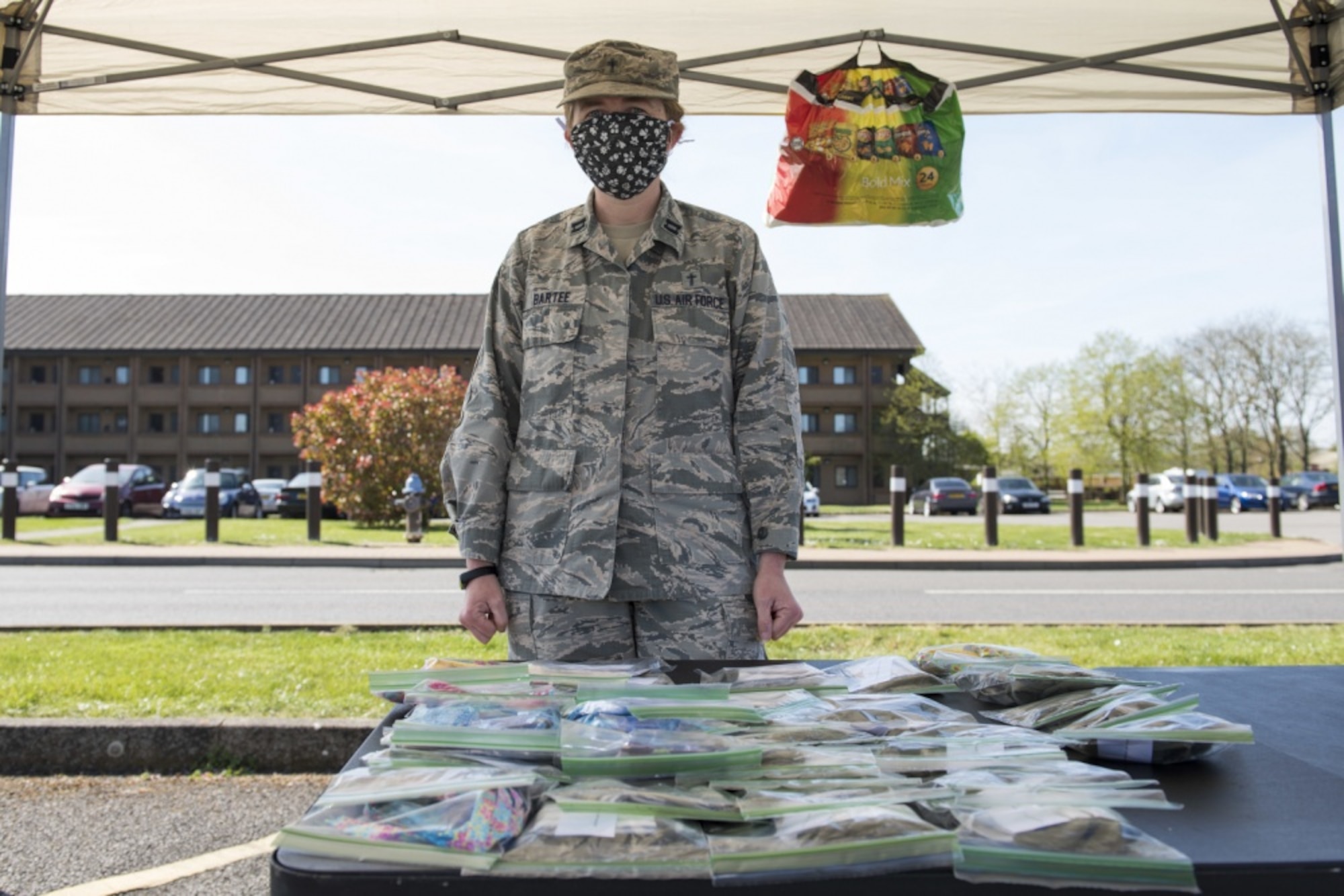U.S. Air Force Captain Amy Bartee, 501 CSW chaplain, volunteers at a face mask giveaway at RAF Alconbury, England, April 15, 2020. Volunteers made 232 cloth face masks, which were given to community members to prevent the spread of COVID-19. (U.S. Air Force photo by Airman 1st Class Jennifer Zima)