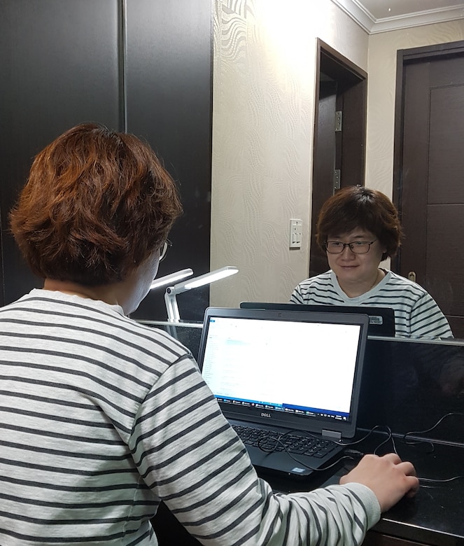 Hur, Myo Boon, U.S. Army Corps of Engineers, Far East District
architectural section chief, conducts work at her home during the district
telework schedule in response to preventing the spread of COVID 19, Apr. 15.