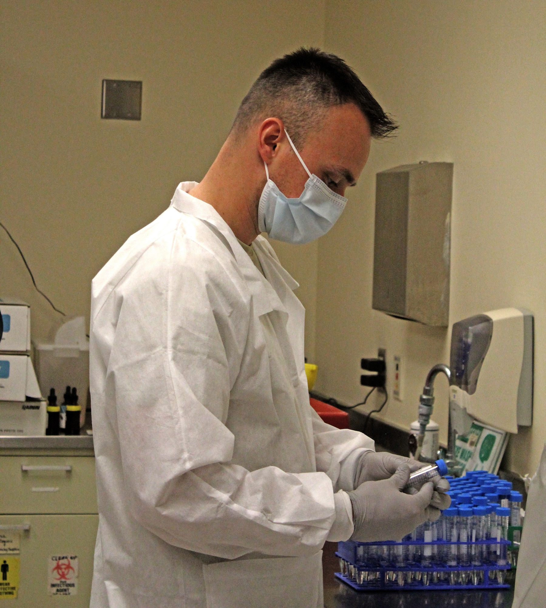 Capt Daniel Wilson, Chief, 88th Medical Group Core Lab, shown here creating in-house vital transport medium for COVID-19 testing due to a national shortage. (U.S. Air Force photo/Kristen Van Wert)