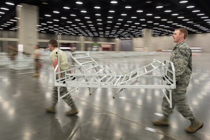 More than 30 members of the Kentucky Air National Guard’s 123rd Civil Engineer Squadron set up hospital beds and clinical space at the Kentucky Fair and Exposition Center in Louisville, Ky., April 11, 2020. The site will be used to treat as many as 288 recovering COVID-19 patients should hospitals exceed capacity. It can be expanded to 2,000 beds.