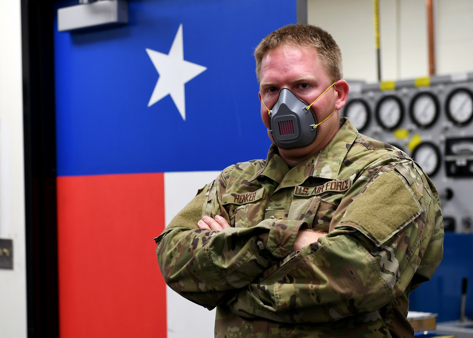 Staff Sgt. Paul Renker, 149th Maintenance Squadron hydraulics technician, wears a mask he made on his personal 3D printer for people in his unit who might need one after initial guidance came out about use and wear for Air Force personnel. (Air National Guard photo by Mindy Bloem)