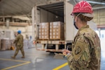 Staff Sgt. Stephanie Kimball assigned to the 1569th Transportation Company, 369th Sustainment Brigade, New York Army National Guard, documents an incoming supply shipment for the COVID-19 response at Stewart Air National Guard  Base in Newburgh, N.Y., April 14, 2020.