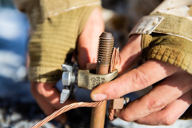 A U.S. Marine secures a ground rod during exercise Northern Viper on Yausubetsu Training Area, Hokkaido, Japan, Jan. 16.