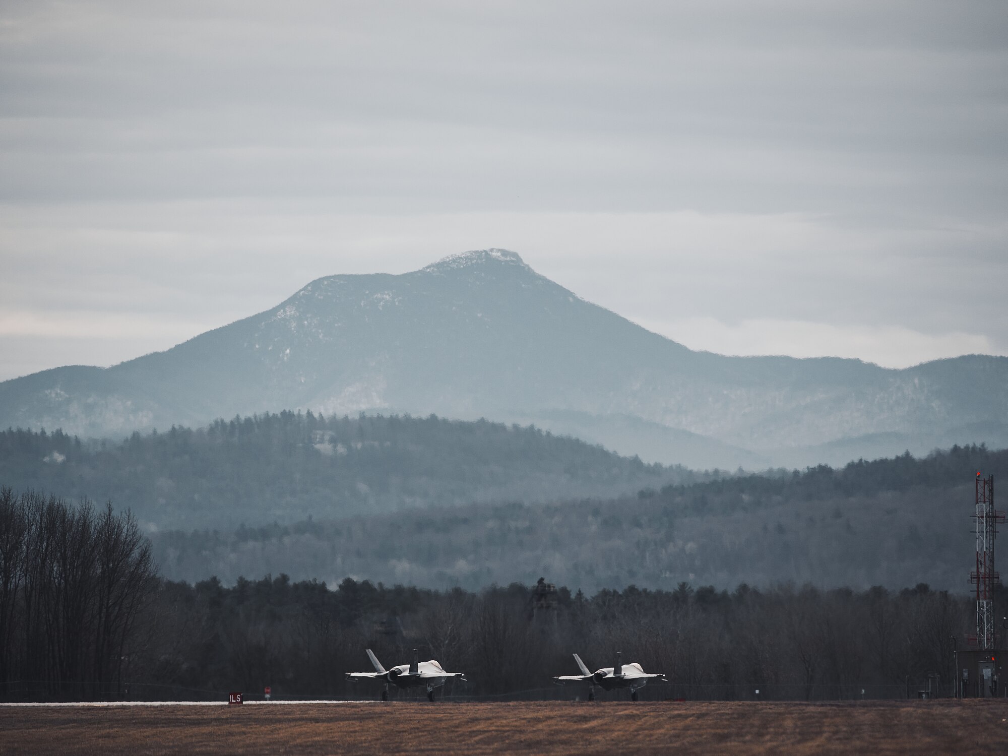 Pilots assigned to the 158th Fighter Wing, Vermont Air National Guard, takeoff for a routine training mission.