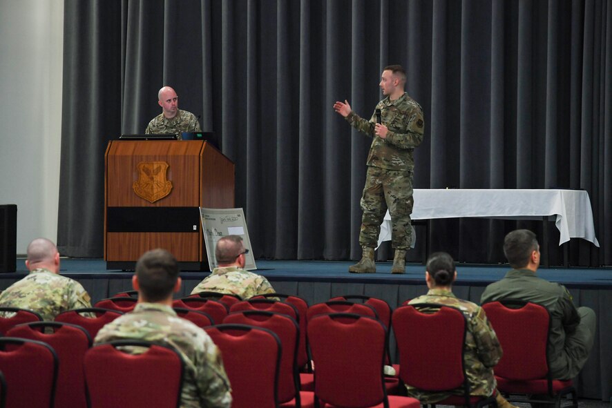 Senior Airman Daniel Kyser, 2nd Maintenance Squadron fabrication flight metals technology apprentice, presents his innovative idea in front of 2nd Bomb Wing leadership and spectators in Hoban hall during Barksdale’s Spark Tank 2020 at Barksdale Air Force Base, La., April 8, 2020. Kyser spoke on the improvements a 3D-printer would bring to not only his shop, but also to the maintenance career field. (U.S. Air Force photo by Senior Airman Taylor Hunter)