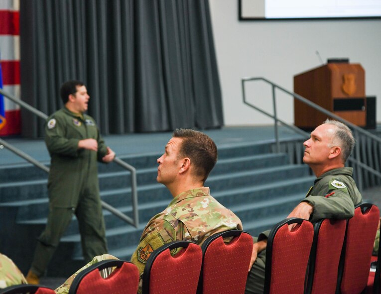 Col. Michael Miller, 2nd Bomb Wing commander, right, and Col. Michael Colvard, 2nd Maintenance Group commander, left, look at presentation slides during Barksdale's Spark Tank 2020 competition at Barksdale Air Force Base, La., April 8, 2020. The judge's listened as eight innovators pitched their ideas before questioning the finalists about impact and implementation.(U.S. Air Force photo by Senior Airman Taylor Hunter)