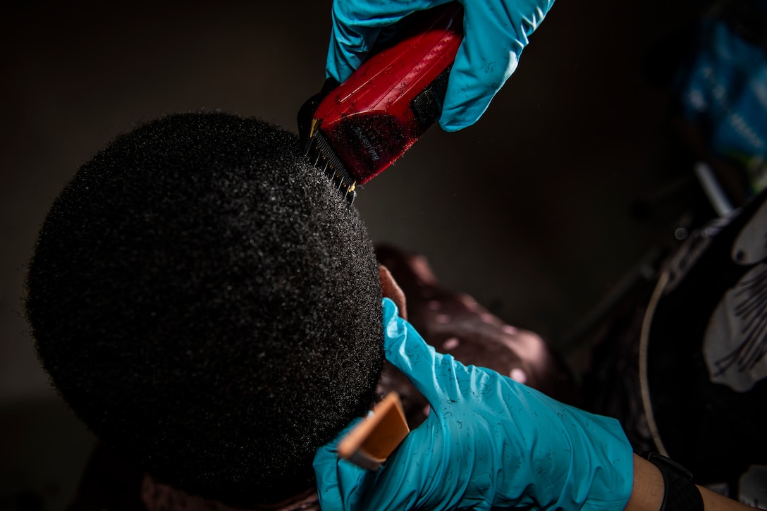 enior Airman Sara Gutherie, 911th Aircraft Maintenance Squadron instruments and controls technician, cuts a fellow Airman’s hair at the Pittsburgh International Airport Air Reserve Station, Pennsylvania, April 9, 2020.