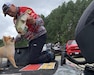 U.S. Army Sgt. 1st Class Bobby Davis and his trusted companion, Fox, make the ultimate bass-fishing team.