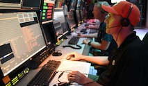 Personnel man the Kwajalein Mission Command Center at the Ronald Reagan Ballistic Missile Defense Test Site on the Kwajalein Atoll in the Republic of the Marshall Islands. (U.S. Army photo by Carrie David Campbell)