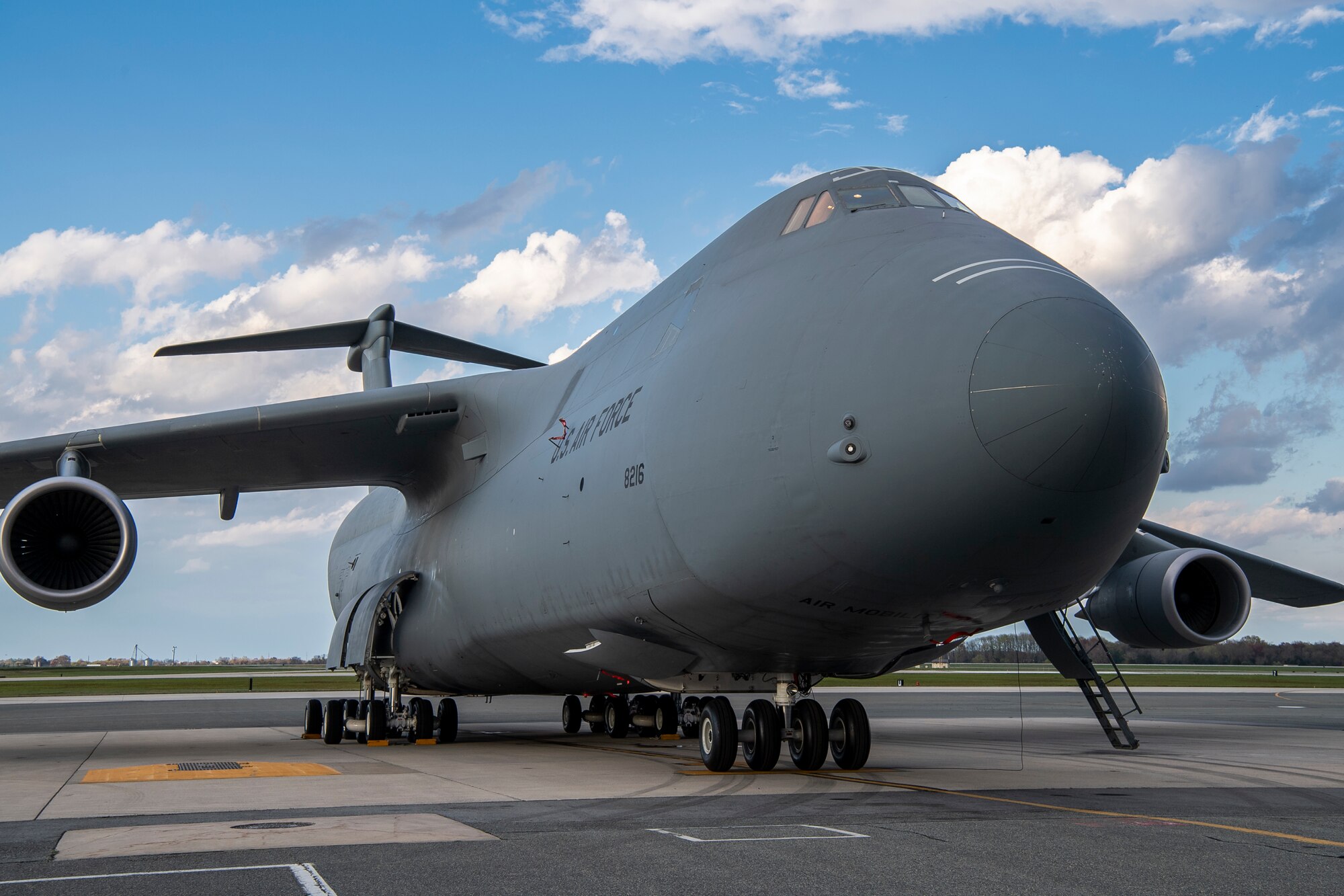 A C-5C Space Cargo Modified Galaxy from Travis Air Force Base, California, is parked on the flight line at Dover AFB, Delaware, April 8, 2020. The C-5C SCM has the troop compartment removed and a modification to the rear loading doors. It is specially modified to carry satellites and other large cargo. (U.S. Air Force photo by Senior Airman Christopher Quail)