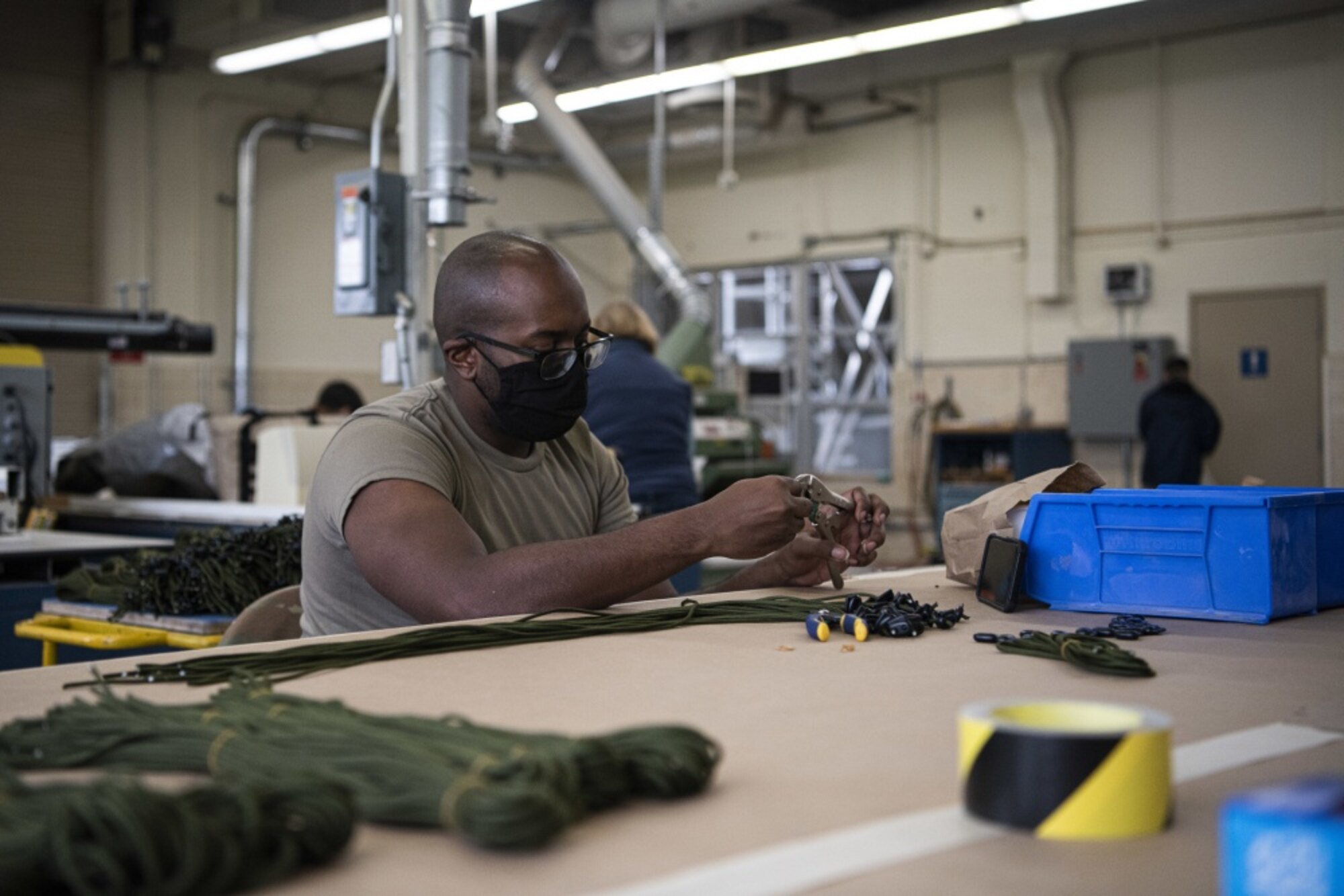 Airman 1st Class Jakorian Rich, 30th Operations Support Squadron intelligence analyst, crafts cloth masks April 14, 2020, at Vandenberg Air Force Base, Calif. Rich and the group of volunteers plan to donate approximately 1,500 masks to members across Vandenberg AFB and roughly 150 masks to the local hospital in response to the COVID-19 pandemic. (U.S. Air Force photo by Airman 1st Class Hanah Abercrombie)