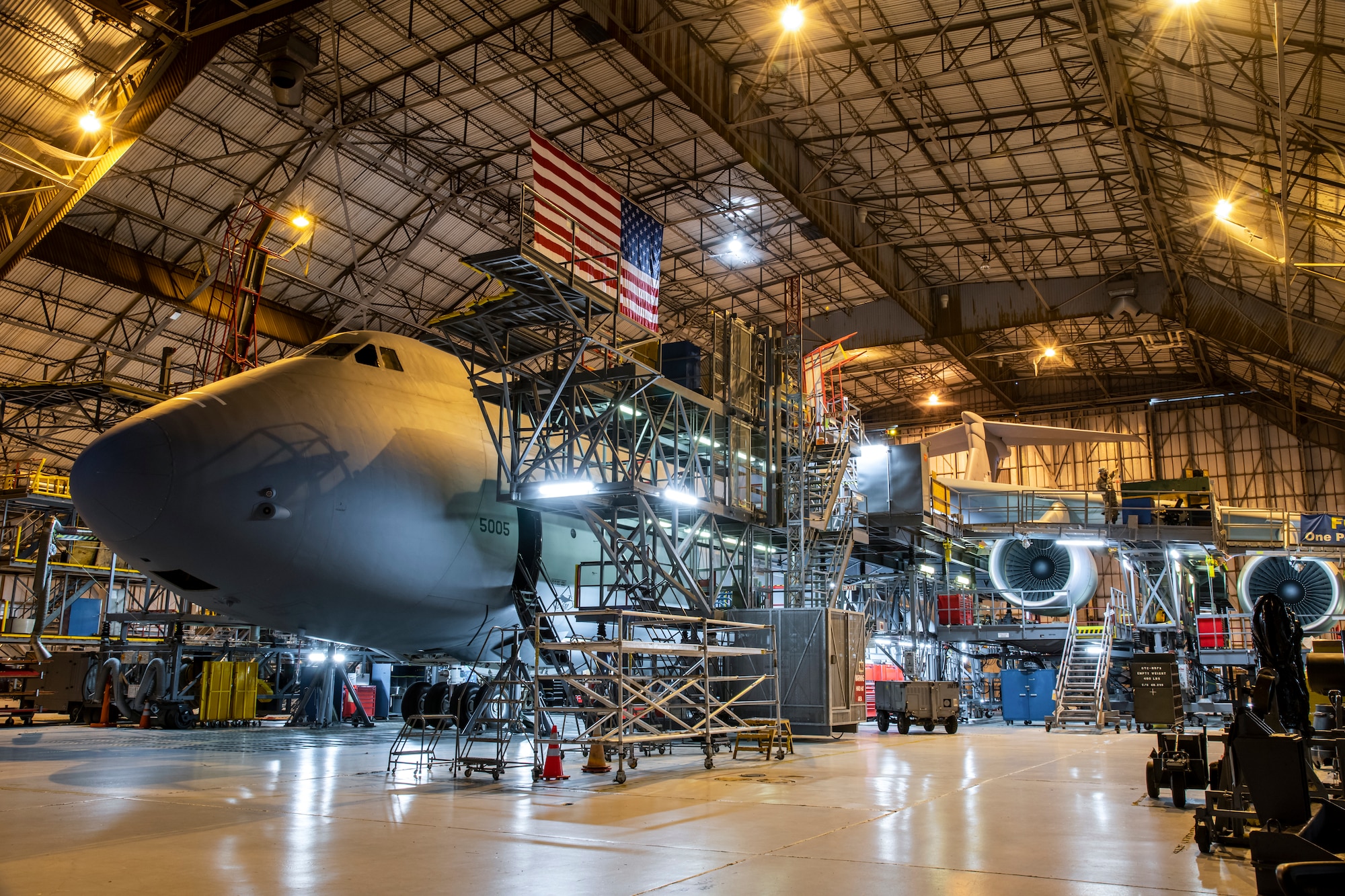 A C-5M Super Galaxy undergoes a major isochronal inspection by 436th Maintenance Squadron aircraft maintenance personnel at the Isochronal Inspection Dock on Dover Air Force Base, Delaware, April 9, 2020. Personnel wore cloth masks and practiced social distancing as much as possible while performing maintenance on the Super Galaxy to help mitigate the spread of COVID-19. (U.S. Air Force photo by Senior Airman Christopher Quail)