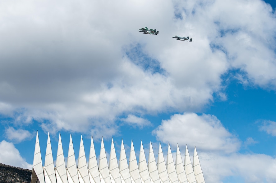 A photo of aircraft flying over the US Air Force Academy