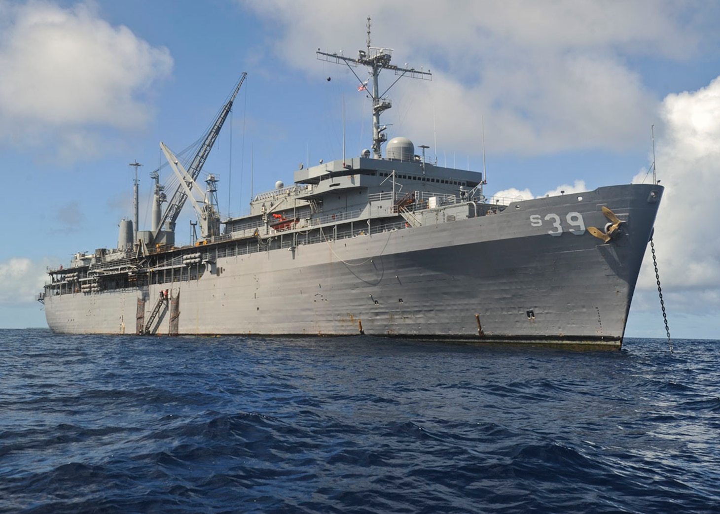 ULITHI, Yap (Dec. 7, 2019) – The submarine tender USS Emory S. Land (AS 39) sits anchored at Ulithi Atoll, Dec. 7. Land is deployed to the U.S. 7th Fleet area of operations to support theater security cooperation efforts in the Indo-Pacific region. (U.S. Navy photo by Mass Communication Specialist 2nd Class Richard A. Miller/Released)
