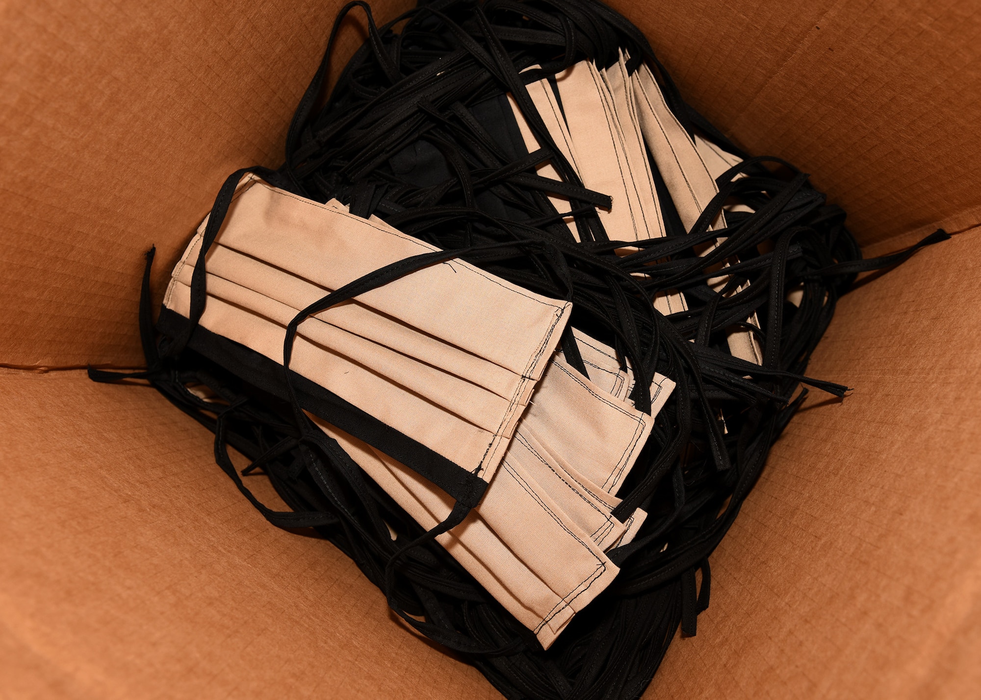 A photo of cloth masks inside a box