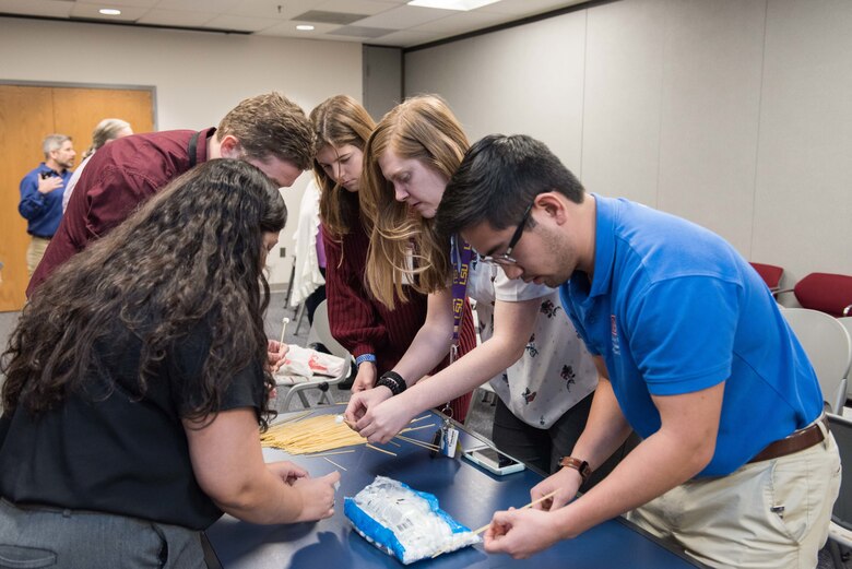 Intern Sally Syndor (top right) works on a team with her U.S. Army Corps of Engineers Transatlantic Middle East District mentors during an Engineer Week competition in February 2020 before the COVID-19 pandemic forced them to finish her internship remotely.