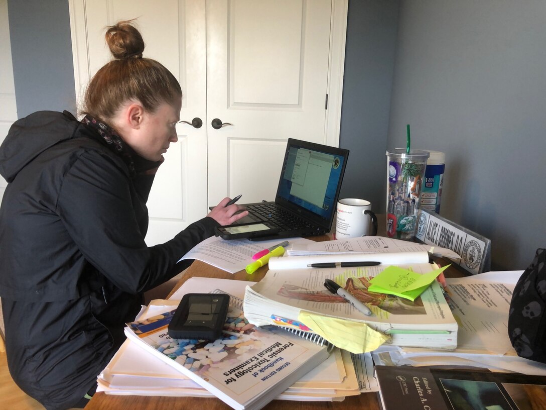 U.S. Air Force Lt. Col. Alice Briones, Armed Forces Medical Examiner System deputy director, teleworks from home April 8, 2020. Guidance has been sent out from the Centers for Disease Control and Prevention and 436th Airlift Wing commander of social distancing and significantly reduced manning due to COVID-19. (Courtesy Photo)