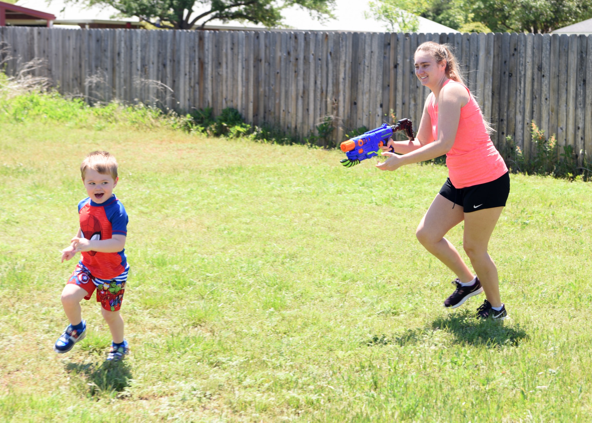 Sydney Sherwood squirts Colby, 3, with a water gun in San Angelo, Texas, April 16, 2020. Water guns have been popular since the late 1800s and remain a popular pastime on hot days. (U.S. Air Force photo by Airman 1st Class Ethan Sherwood)