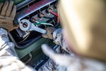 A U.S. Marine wires load-studs during exercise Northern Viper on Yausubetsu Training Area, Hokkaido, Japan, Jan. 16.