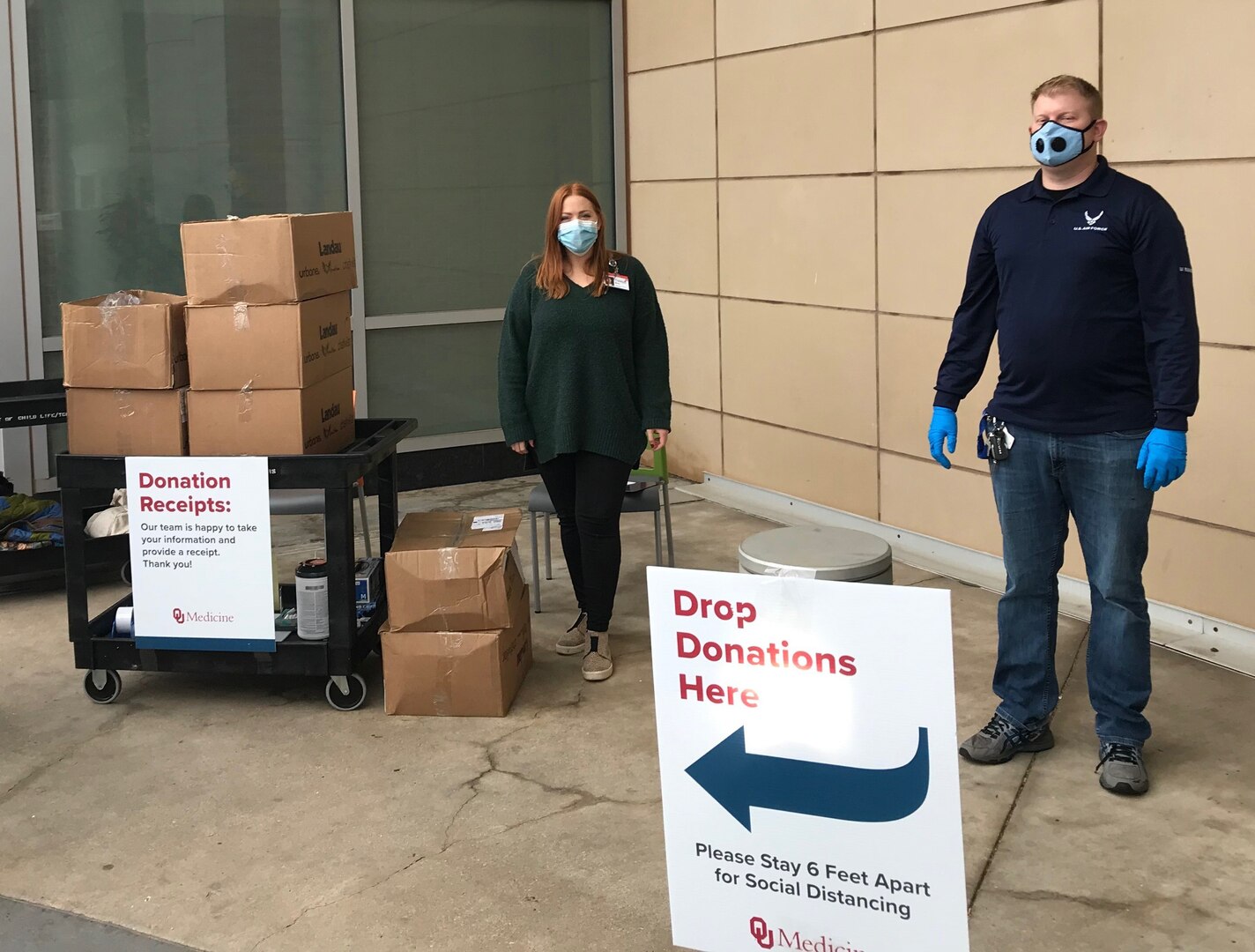 Tech. Sgt. Jordan Nelson, 342nd Recruiting Squadron, H-Flight, (Right) helps deliver Air Force Health Professions scrubs to a hospital in his area.