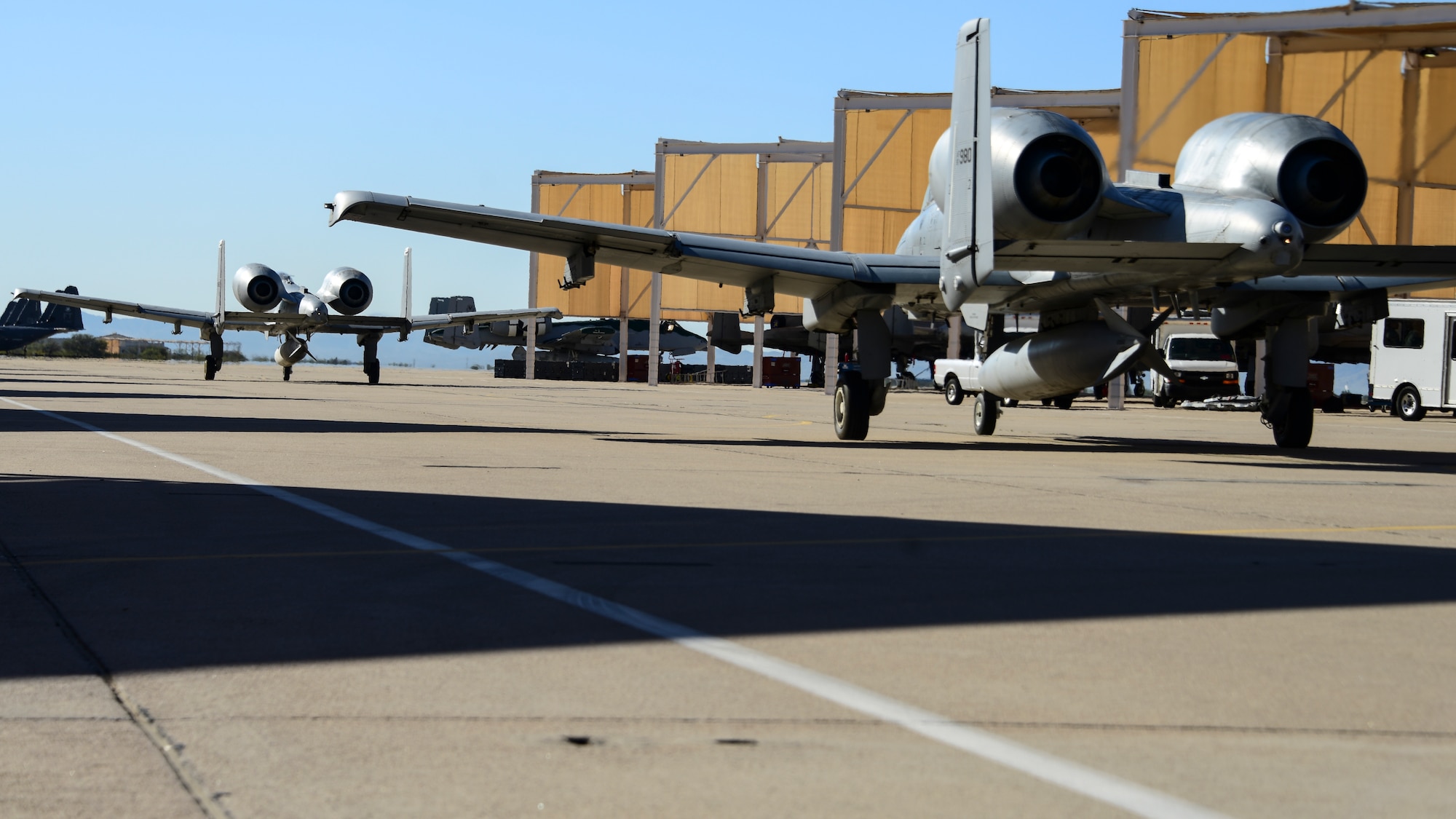 A photo of A-10s taxing on the flight line