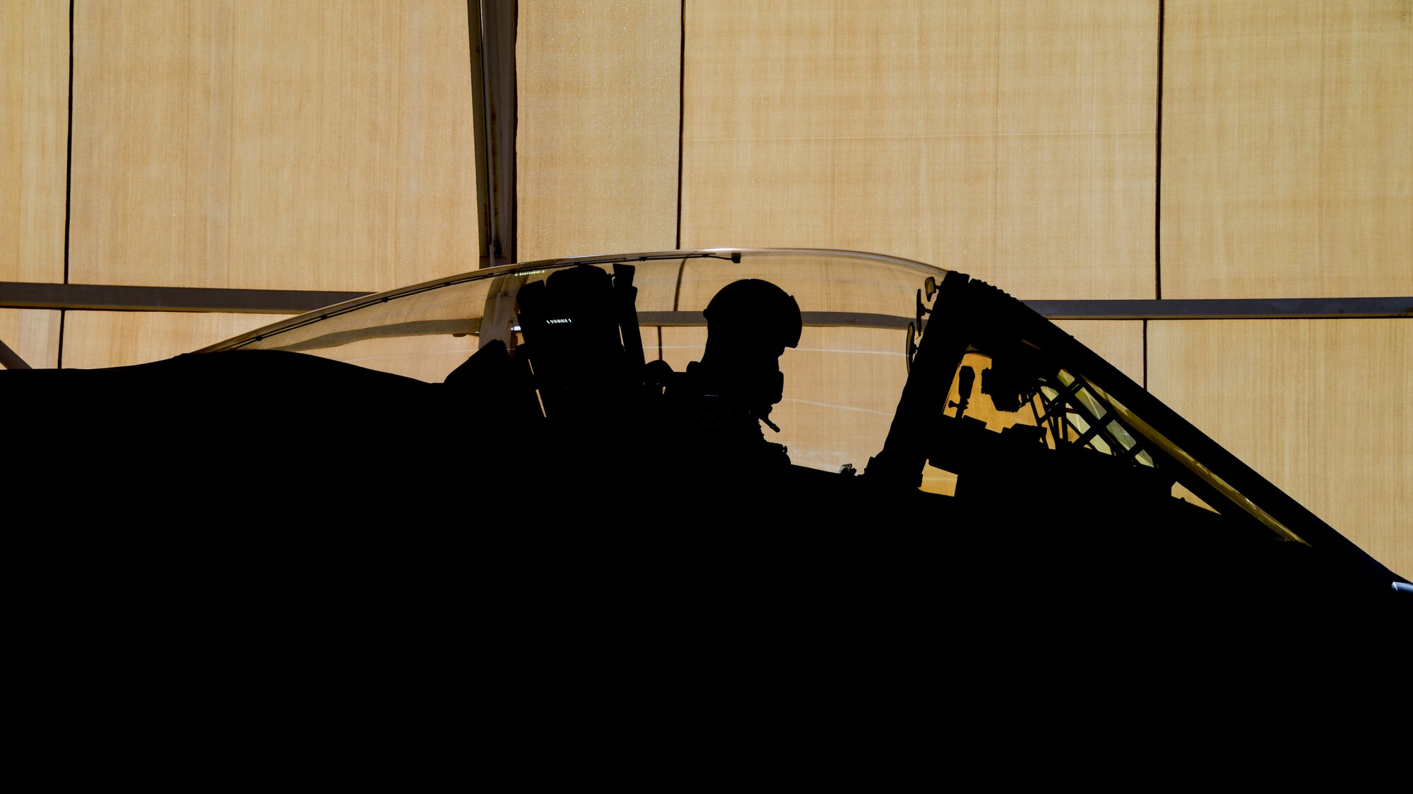 A photo of a pilot in the cockpit