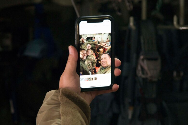 Chief Master Sgt. Kevin Cassidy, 934th Aeromedical Evacuation Squadron superintendent, takes a selfie with deploying 934 AES Airmen aboard a C-130H Hercules at Minneapolis-St. Paul Air Reserve Station. (courtesy photo)
