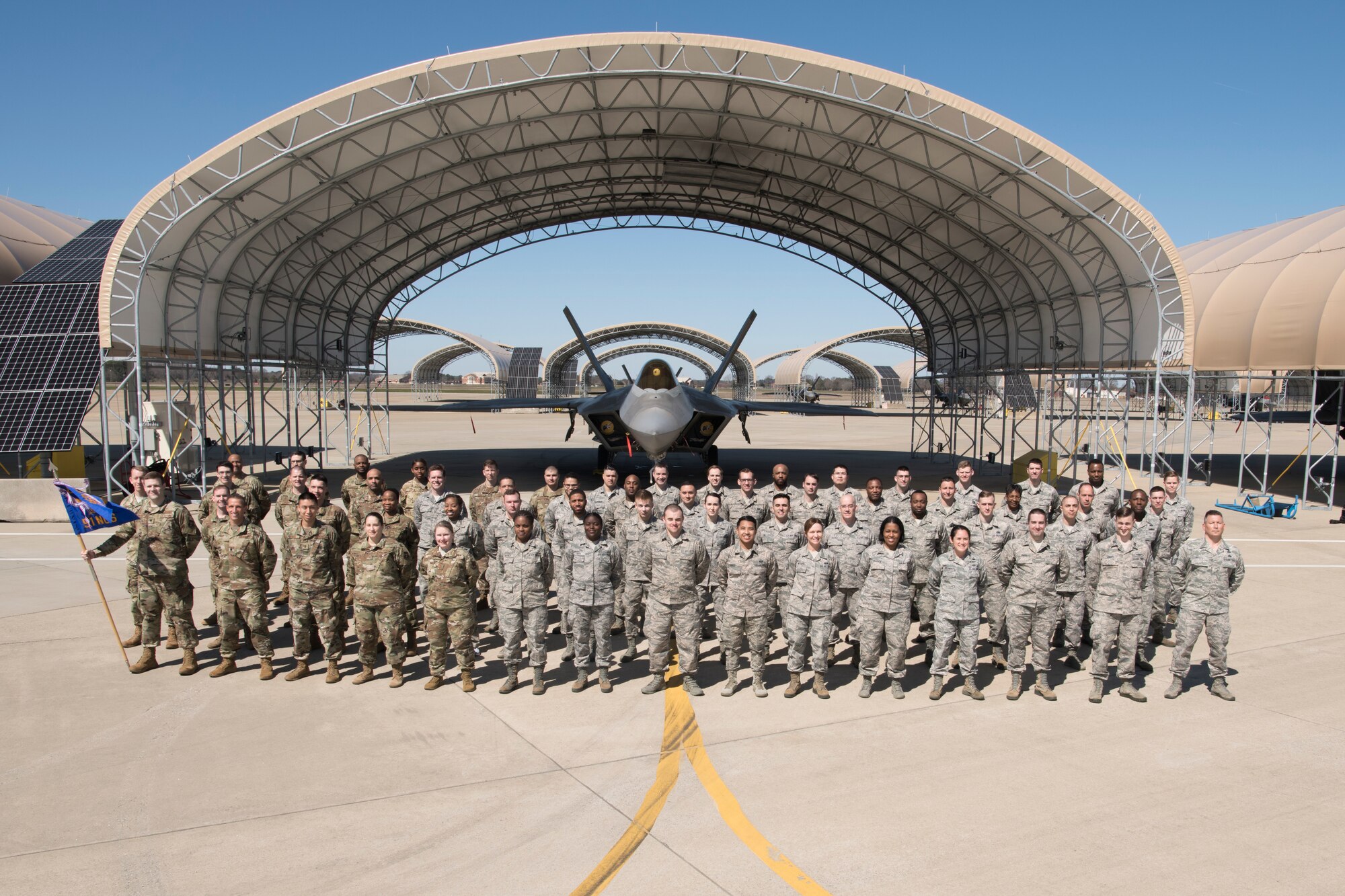 Members of the 51st Network Operations Squadron stand for a group photograph at Joint Base Langley-Eustis, Virginia, March 8, 2020, prior to social distancing guidelines issued as a response to COVID-19. In any given month, the 51st NOS convenes its forces to employ the Cyber Security Control System’s capabilities and execute U.S. Cyber Command taskings across several missions. (U.S. Air National Guard photo by Staff Sgt. Lucretia Cunningham)