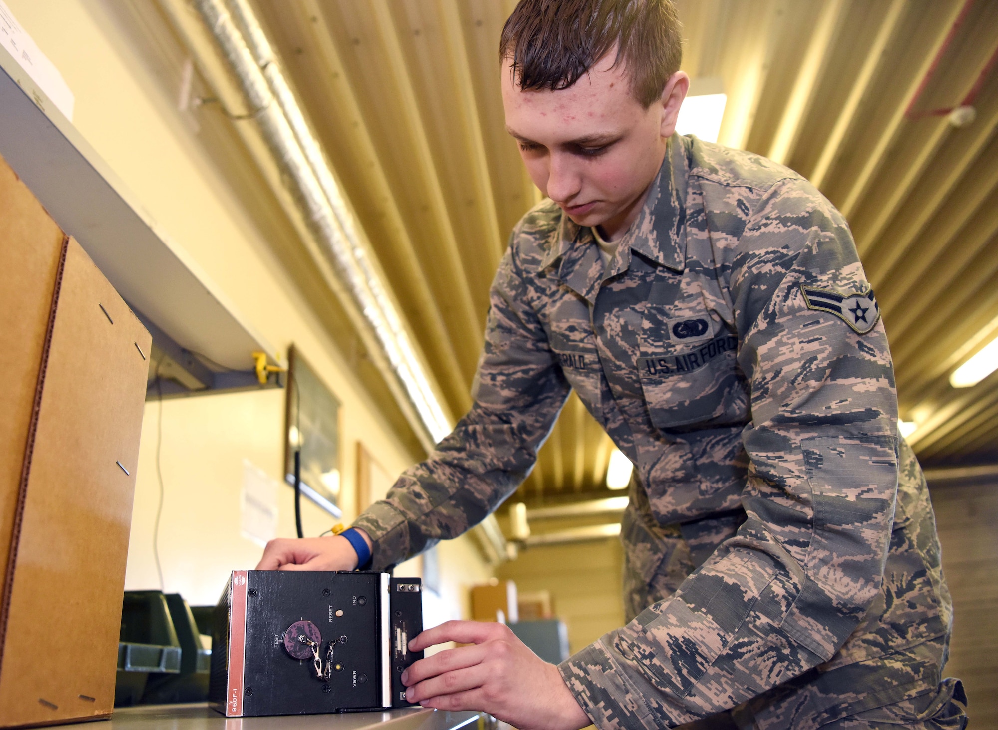 Airman 1st Class Patrick Fitzgerald, 100th Logistics Readiness Squadron flight service center technician, uses an electrostatic dissipative table to inspect an item at RAF Mildenhall, England, April 15, 2020. The flight service Airmen are responsible for the tracking, inspecting, verifying, delivering and picking up all parts from maintenance squadrons on base. (U.S. Air Force photo by Senior Airman Brandon Esau)