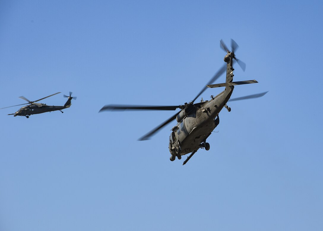 Two U.S. Air Force HH-60G Pave Hawk helicopters operated by the 56th Rescue Squadron fly over Aviano Air base, Italy, April 9, 2020. The 56th RQS provides a rapidly-deployable, worldwide combat rescue and reaction force response utilizing HH-60G Pave Hawk helicopters. (U.S. Air Force photo by Airman Thomas S. Keisler IV)