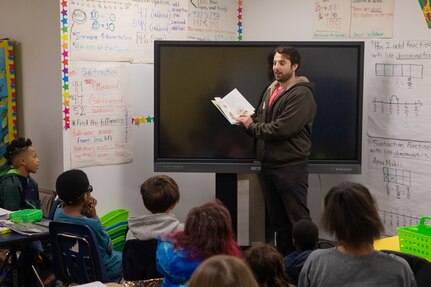 Code 2380 Nuclear Engineer Matthew Antonelli represents Norfolk Naval Shipyard in his first Read Across America Day at James Hurst Elementary School Mar. 2.