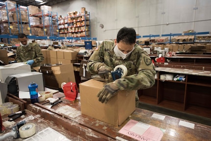 An Indiana National Guard Soldier from the 38th Sustainment Brigade packs commissary orders for Indiana offenders at the Plainfield Correctional Facility, Plainfield, Indiana, April 14, 2020.